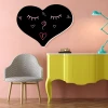 Chalkboard magnetic heart 015 - Decor in a child\'s room with pink walls and light-colored furniture.