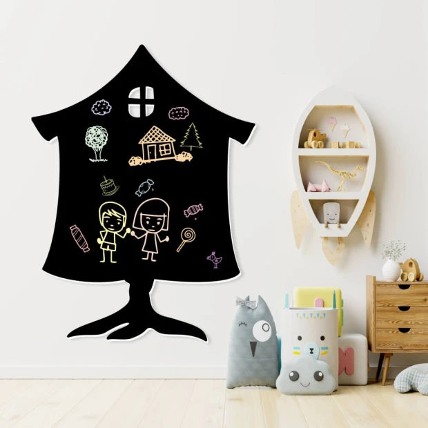 Chalkboard magnetic board for kids in a house shape with drawings of children, trees, and clouds.
