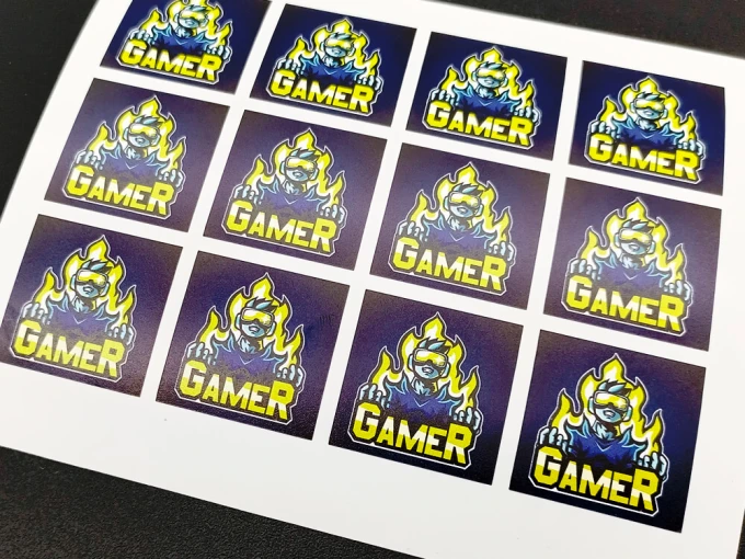 Custom adhesive label - Graphic design. Square stickers featuring a character in flames with the text GAMER.