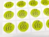 Custom adhesive label - Graphic design. Round green background with ECO text and leaf.
