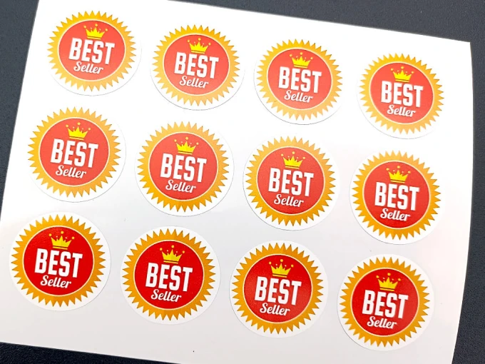Custom printed self-adhesive label - Graphic design. Round stickers with BEST Seller text and crown.