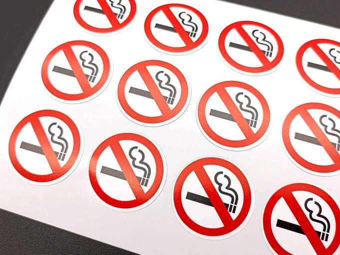 Custom printed adhesive label - Graphic design. Round stickers with a no smoking symbol.