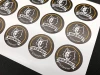 Custom adhesive label - Graphic design. Round stickers featuring a wolf image and text.