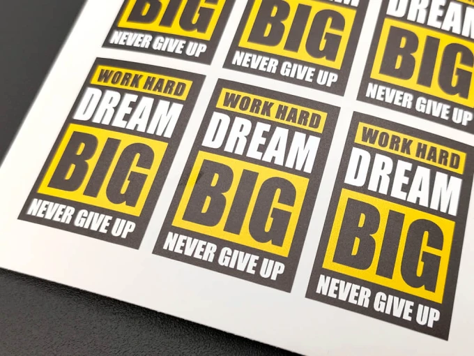 Custom printed self-adhesive label - Graphic design. Rectangular labels with text in yellow and black.