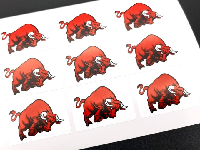 Custom adhesive label - Graphic design. Ten red bulls on a white background.