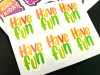 Custom-shaped adhesive labels on a sheet - Graphic design. Letter shapes in orange and green colors.