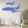 Stylish airplane stickers in pastel colors, perfect for a child\'s room, adding a cheerful touch.