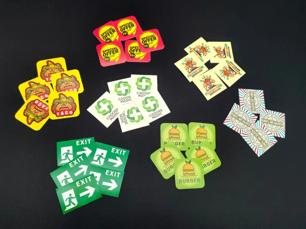 Custom printed adhesive stickers - Graphic design. Includes various shapes, including round and rectangular.