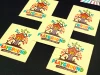 Custom printed adhesive stickers - Square shape with a colorful house and tree design.