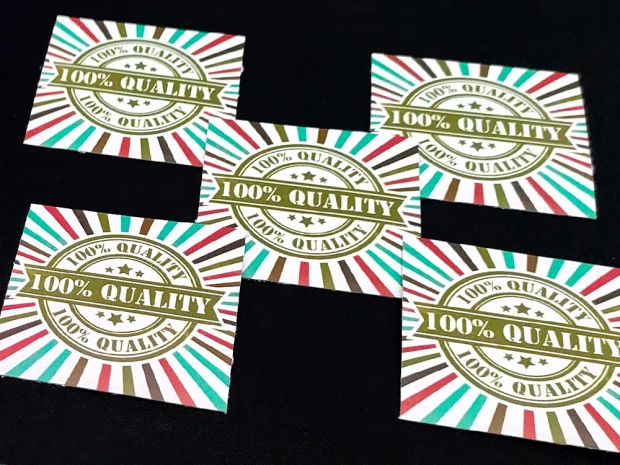 Custom adhesive stickers - Graphic design. Simple rectangles with "100% QUALITY" text on a striped background.