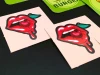 Custom adhesive stickers - Graphic design. Red lips with a hanging cherry on a light background.