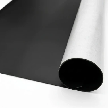 Self-adhesive magnetic strip by the meter, 61cm wide - Graphic design. Black smooth surface, white paper backing.