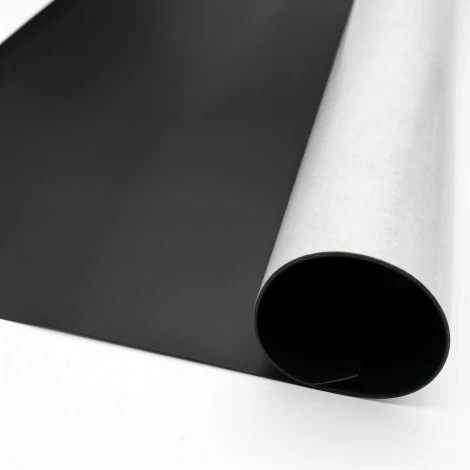 Self-adhesive magnetic strip by the meter, 61cm wide - Graphic design. Black smooth surface, white paper backing.