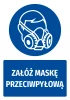 Safety sticker with dust mask icon - round design featuring a person in a mask and text.