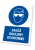 Safety sign with a pictogram: Wear safety glasses - Graphic design. Round icon featuring a figure with safety glasses.
