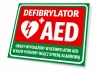 AED Defibrillator Information Sign - Graphic design with red background, white text, and heart symbol with lightning bolt.