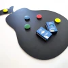 Chalkboard magnetic board in pear shape with colorful circular magnets.