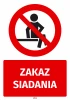 Safety sticker: No Sitting - Graphic design with a red background and a black crossed-out sitting person symbol.