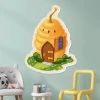 Magnetic dry-erase board shaped like a bee house - perfect for a child\'s room with light-colored walls.