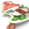 Magnetic dry-erase board shaped like a mushroom house with a red roof and windows.