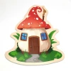 Magnetic dry-erase board shaped like a mushroom house with a red roof and windows.