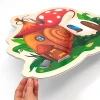Magnetic dry-erase board shaped like a snail house with a red roof and mushroom design.