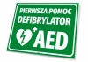 First Aid Sign Defibrillator AED - Graphic design. Green background with white text and heart symbol with lightning bolt.