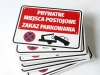 Private parking spaces sign, no parking - Graphic design. Red background with white text and towing icon.