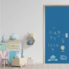 Custom chalkboard door sticker - Decor in a child\'s room. Intense blue walls, light furniture.