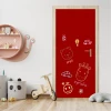 Custom chalkboard door sticker - Ideal for a child\'s room with red walls and light-colored furniture.