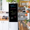 Custom chalkboard sticker for fridge - Kitchen arrangement with light furniture and plants in the background.