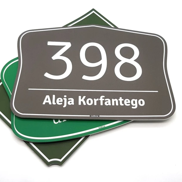 Address plaque with house number - Rectangular shape with rounded corners, white digits on a dark background.