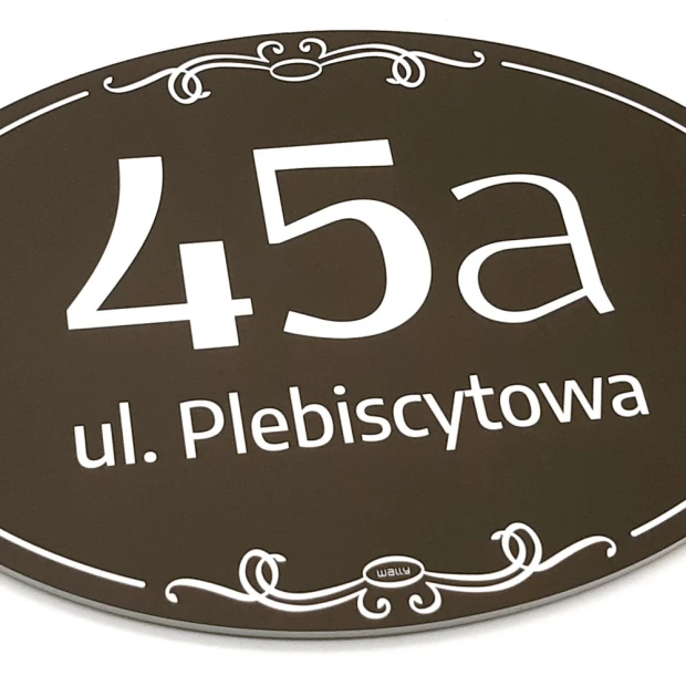 Address plaque, house number - Graphic design. Oval shape, dark background, white numbers and text.