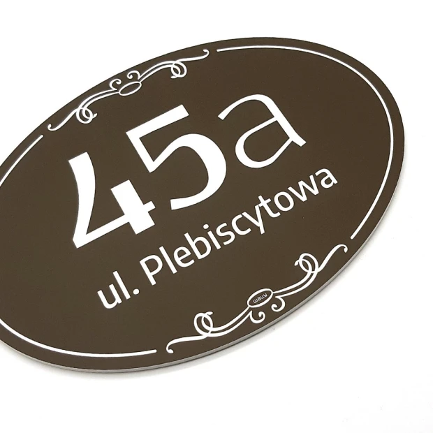 Address plaque, house number - Graphic design. Oval shape, brown background, white numbers and text.