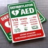 AED Defibrillator sign with instructions - Rectangular sign with a green background and white and red details.