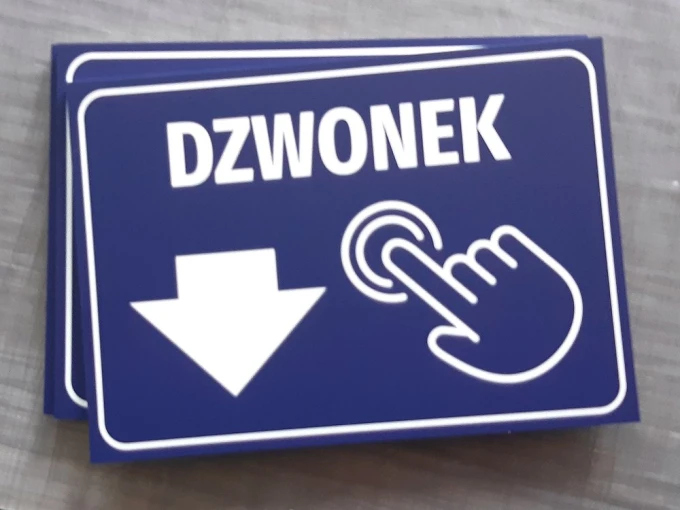 Information plaque for building: Doorbell - Graphic design. Blue background with white text and hand symbol.