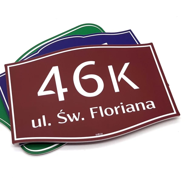 Building plaque with address and number - Graphic design. Rectangular sign with white text on a dark background.