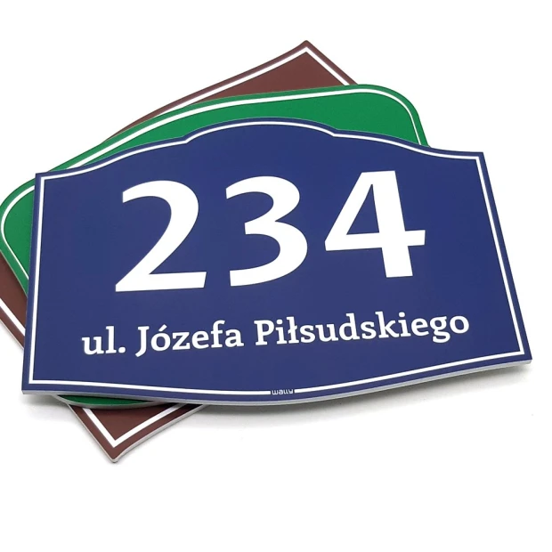 Rectangular house plaque with number and address - graphic design, featuring large digits and text on a colored background.