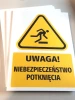 Warning safety sign with a slip hazard pictogram - yellow triangle with black design.