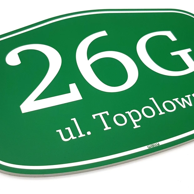 Green address plaque with rounded edges and white lettering. Ideal for home numbering.