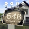 Street name and house number plaque - Rectangular design with clear number and text on a background.