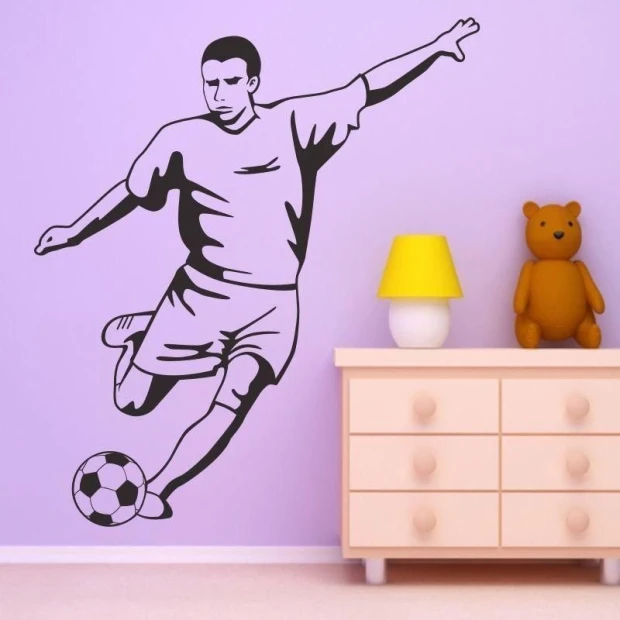 Soccer player wall stencil 1164 - Decorated in a children\'s room with purple walls and light furniture.