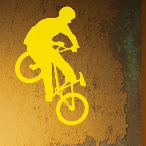 Dynamic bike sticker in vibrant yellow, perfect for a modern youth room.