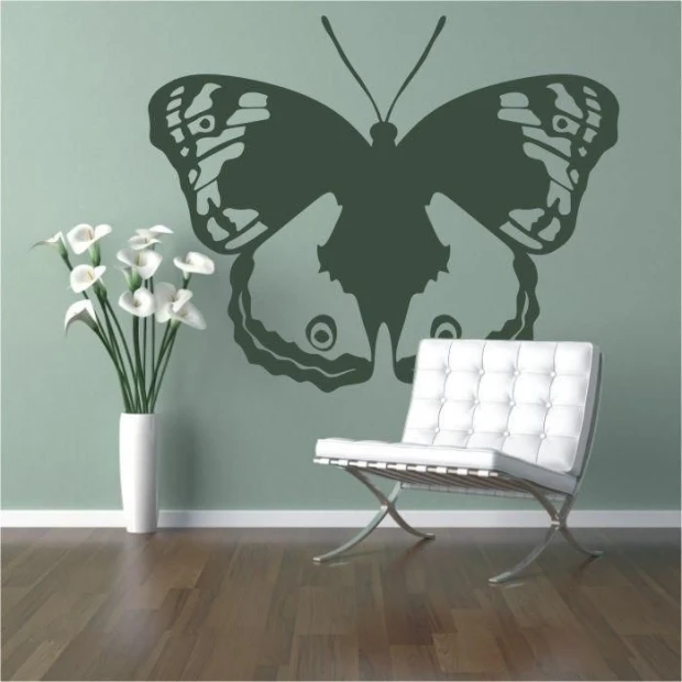 Elegant butterfly sticker 007 in muted green, perfect for a modern living room, adding a touch of lightness.