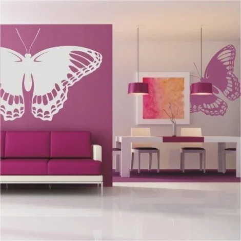 Elegant butterfly sticker 010 in a modern living room, adding lightness and color to a purple wall.