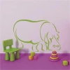A cheerful green hippo decorates a child\'s room, adding a joyful touch.