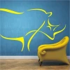 Stylish yellow rhinoceros sticker, perfect for a modern interior with blue accents.