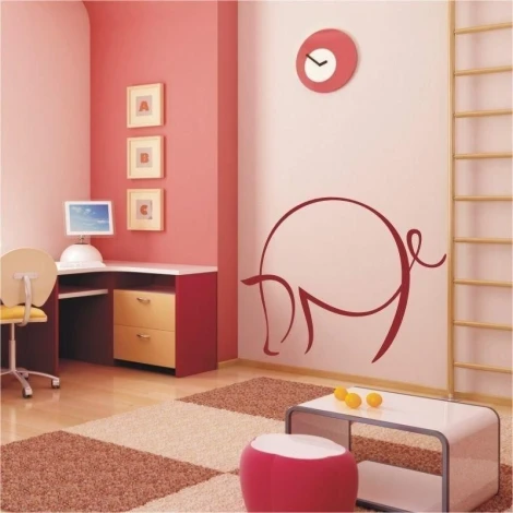 Charming pig sticker in a pastel children\'s room, adding a cheerful touch to the wall.