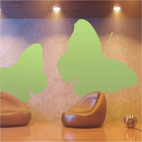 Green butterflies that enliven a modern living room, adding lightness and freshness to the space.
