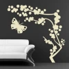 Butterfly tree sticker in a modern living room with soft beige tones creates a harmonious atmosphere.
